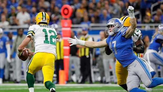 Green Bay Packers quarterback Aaron Rodgers and Detroit Lions lineman Aidan Hutchinson
